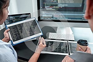 Team of Developer programmer working on coding program software computer in office, Writing website and development database