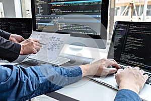 Team of developer programmer working on project in software development computer in IT company office, Writing codes and data code