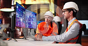 Team Of Diverse Engineers Using Innovative Automation System photo