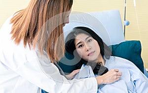 Team of doctor examining a female patient