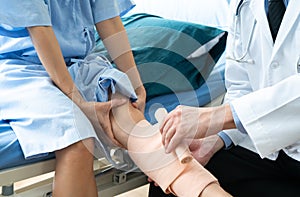 Team of doctor examining a female patient