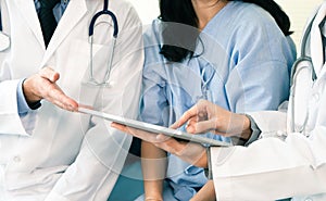 Team of doctor examining a female patient