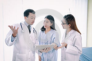 Team of doctor examining a female patient