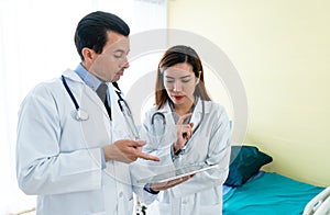 Team of doctor examining to medical reports