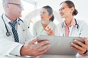 Team of doctors in meeting discussing a case