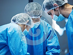 Team of doctors n surgery, healthcare and surgical procedure start with PPE and collaboration in operation theatre in