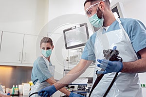 Team of doctors performing endoscopy in hospital