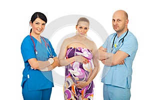 Team of doctors and pregnant woman