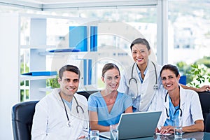 Team of doctors smiling at camera