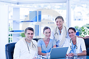 Team of doctors smiling at camera