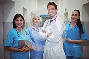 Team of doctors standing in corridor