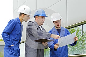 Team electricians at construction site