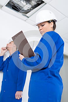 Team electricians working at construction site