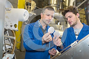 Team engineers having discussion in factory