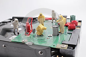 the Team of engineers repairing circuit board