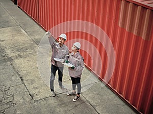 A team of engineers talks to managers at the Container cargo