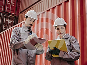 A team of engineers talks to managers at the Container cargo