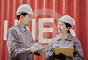 A team of engineers talks to managers at the Container cargo