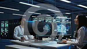 Team of engineers using AI tech on computer to do checkup in server room