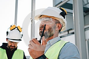 Team of engineers working on construction site