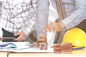 Team engineers working with construction tools on table