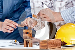 Team engineers working with construction tools on table