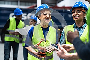 Team of engineers working in robotic factory