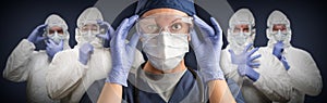 Female and Male Doctors or Nurses Team Wearing Protective Medical Face Masks and Goggles Banner photo