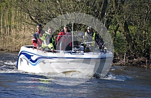 Team in fishing motorboat