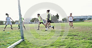 Team, football and women score goal at field, exercise or workout in competition. Group, kick and girls play soccer on