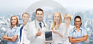 Team or group of doctors with tablet pc computer