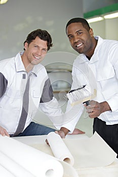 team happy painters smiling at camera