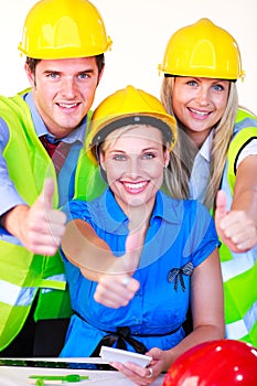 Team with hard hats looking at the camera