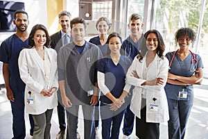 Team of healthcare workers at a hospital smiling to camera photo