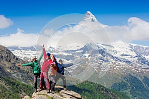 Team of hikers on the rocky summit