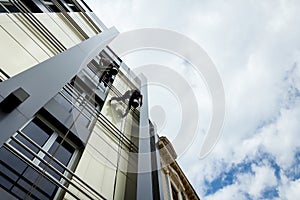 Team of industrial climbers at work, they are washing building f