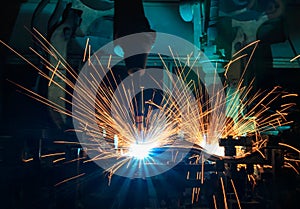 Industrial robot welding are movement welding car part in automotive industrial factory