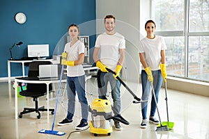 Team of janitors in office