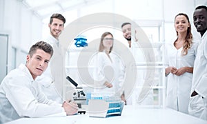 Male Scientist Working With Microscope
