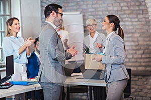 Team leader executive introducing new just hired female employee to colleagues