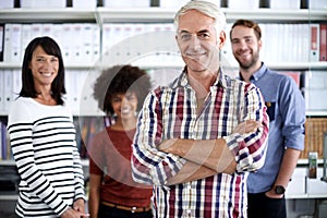 The team that makes things happen. Portrait of a team of business professionals in an office environemt.