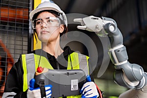 A team of male and female engineers meeting to inspect computer-controlled steel welding robots. Plan for rehearsals and