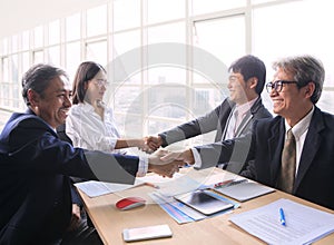 Team of man and woman business people successful shaking hand a