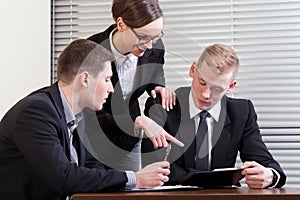 Team manager and workers during work