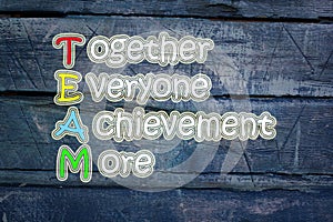 Team meaning written on blackboard background, high