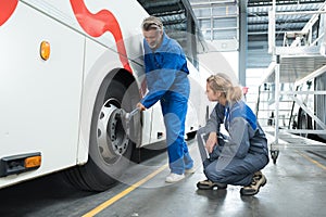 team mechanics working at garage