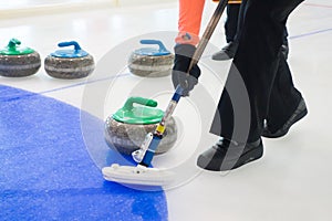Team members play in curling