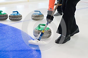 Team members play in curling