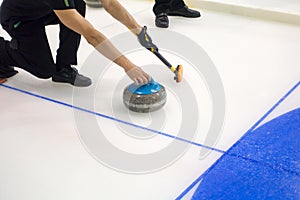 Team members play in curling