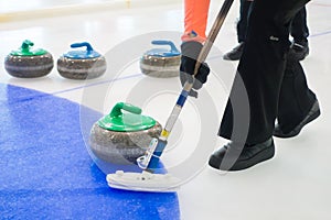 Team members play in curling